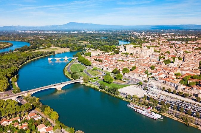 Avignon from the air: the walled old town, the bend of the Rhône and the island beyond
