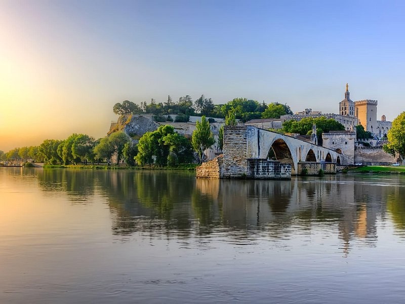 The old bridge and the popes' palace at sunset, the Rhône calm in front
