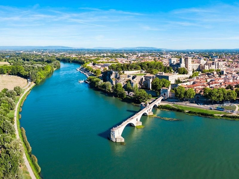 The Rhône from the air, the broken bridge reaching out from the walled city